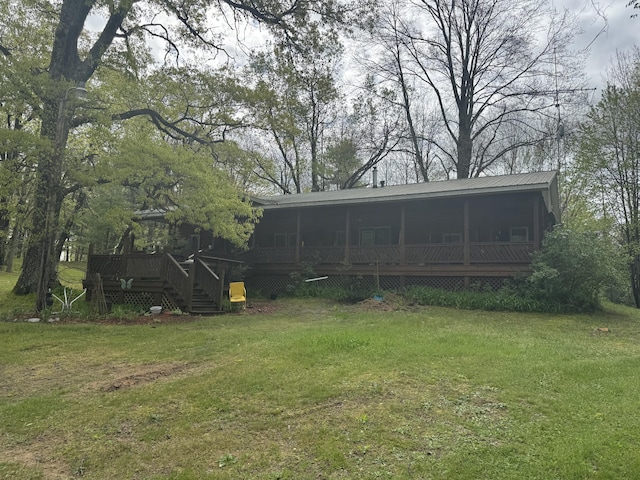 7215 E Niemitalo Dr, Chase, MI 49623 - view of green lawn with a deck