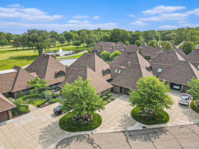 9095 S Saginaw Rd Unit 10, Grand Blanc, MI 48439 - aerial view of residential area featuring a large body of water and a tree filled landscape