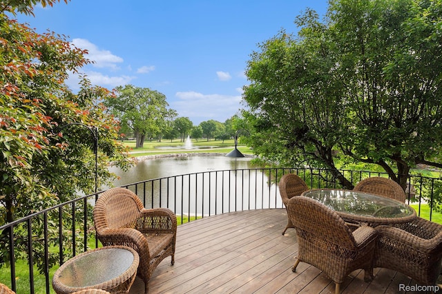9095 S Saginaw Rd Unit 10, Grand Blanc, MI 48439 - wooden deck featuring a water view and outdoor dining area