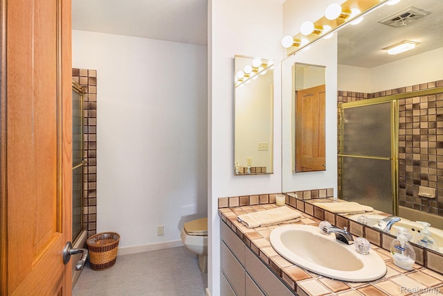 9095 S Saginaw Rd Unit 10, Grand Blanc, MI 48439 - bathroom featuring toilet, vanity, tiled shower, and baseboards