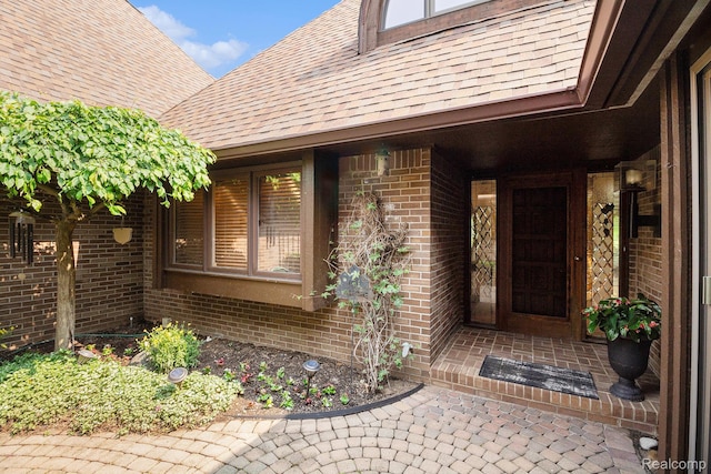 9095 S Saginaw Rd Unit 10, Grand Blanc, MI 48439 - entrance to property featuring a shingled roof and brick siding