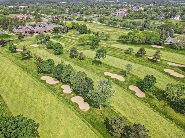 9095 S Saginaw Rd Unit 10, Grand Blanc, MI 48439 - aerial view of property and surrounding area featuring a golf club and a tree filled landscape