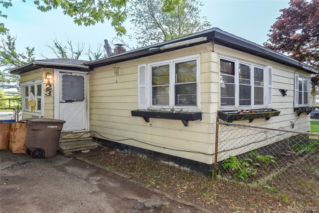 123 Parkdale Ave, Pontiac, MI 48340 - view of property exterior featuring entry steps and a chimney