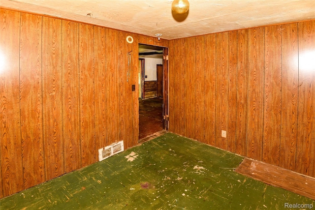 123 Parkdale Ave, Pontiac, MI 48340 - spare room featuring wooden walls