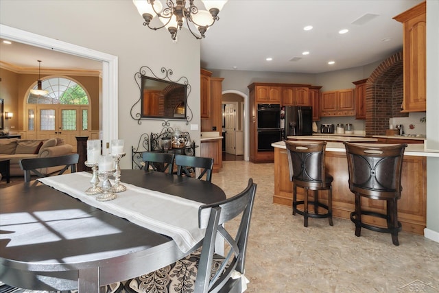 3283 Foxfire Dr, Milford, MI 48380 - dining room featuring a chandelier, arched walkways, and recessed lighting