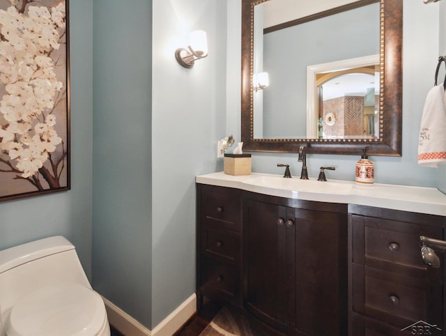 3283 Foxfire Dr, Milford, MI 48380 - bathroom with vanity, toilet, and baseboards