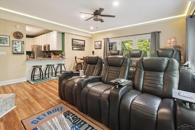 3283 Foxfire Dr, Milford, MI 48380 - home theater room with a ceiling fan, light wood finished floors, baseboards, recessed lighting, and ornamental molding