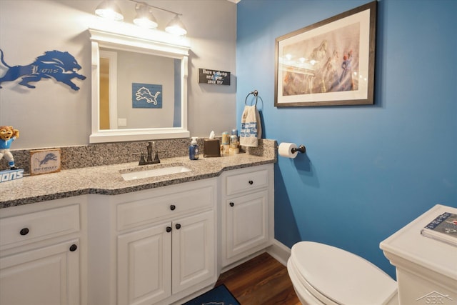 3283 Foxfire Dr, Milford, MI 48380 - bathroom with vanity, toilet, and wood finished floors