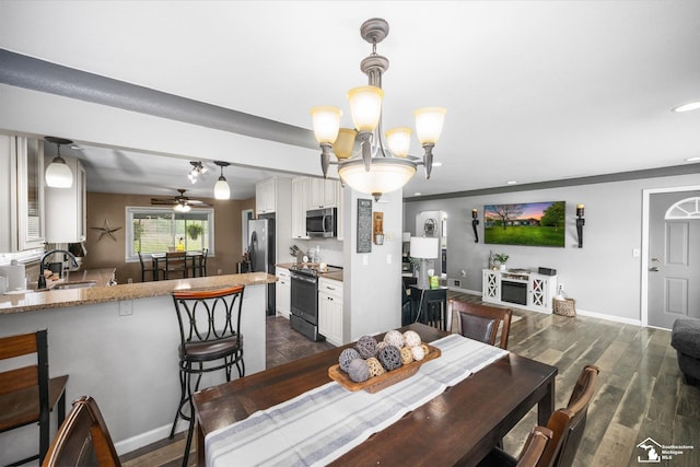 4851 Consear Rd, Ottawa Lake, MI 49267 - dining space featuring recessed lighting, a ceiling fan, baseboards, a chandelier, and dark wood-style floors