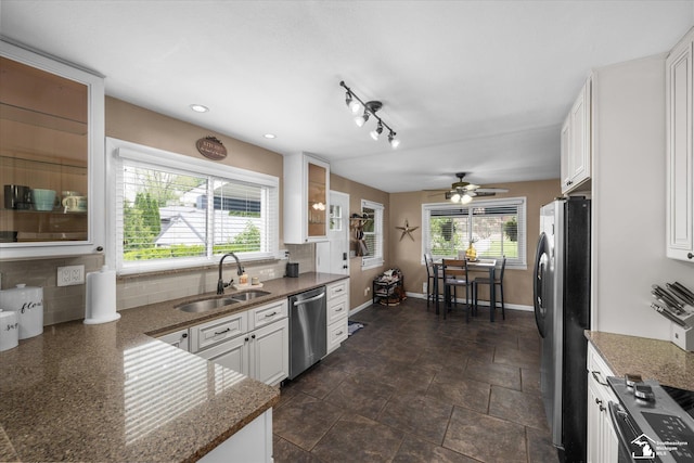 4851 Consear Rd, Ottawa Lake, MI 49267 - kitchen with stainless steel appliances, a sink, decorative backsplash, healthy amount of natural light, and recessed lighting