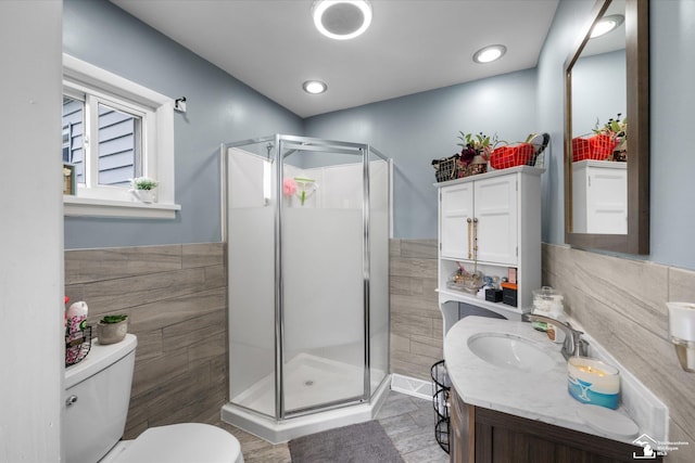 4851 Consear Rd, Ottawa Lake, MI 49267 - full bath with toilet, a stall shower, vanity, and tile walls