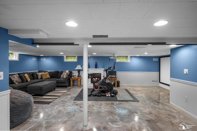 4851 Consear Rd, Ottawa Lake, MI 49267 - basement featuring a wainscoted wall, healthy amount of natural light, and a lit fireplace