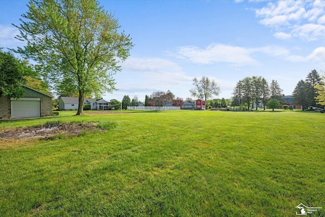 4851 Consear Rd, Ottawa Lake, MI 49267 - view of grassy yard with a garage