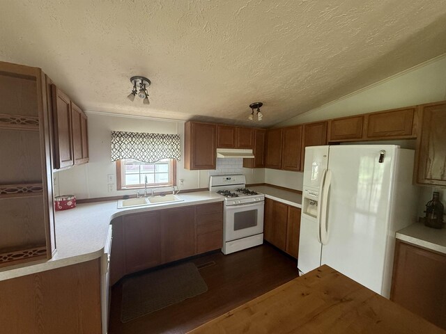 59 Clydesdale Dr, Mount Morris, MI 48458 - kitchen with white appliances, a sink, a textured ceiling, brown cabinets, and vaulted ceiling