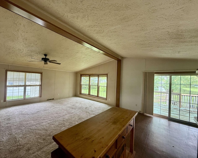 59 Clydesdale Dr, Mount Morris, MI 48458 - unfurnished living room with a textured ceiling, lofted ceiling, and ceiling fan