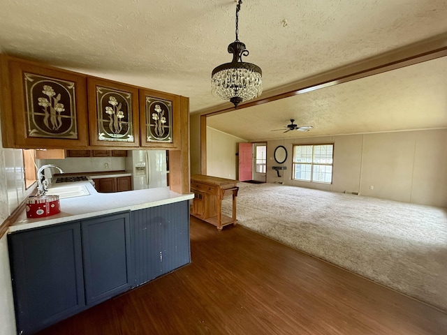 59 Clydesdale Dr, Mount Morris, MI 48458 - kitchen with a sink, white fridge with ice dispenser, a textured ceiling, dark wood finished floors, and a chandelier