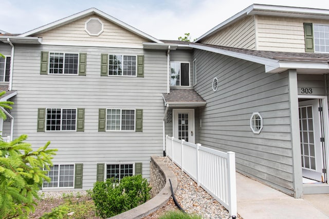 4164 W Centre Ave Unit 103, Portage, MI 49024 - back of house with a shingled roof