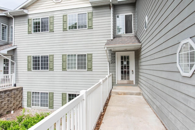 4164 W Centre Ave Unit 103, Portage, MI 49024 - doorway to property with roof with shingles
