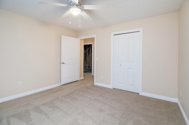 6509 Elle Ave, Portage, MI 49024 - unfurnished bedroom with carpet, baseboards, a closet, and ceiling fan