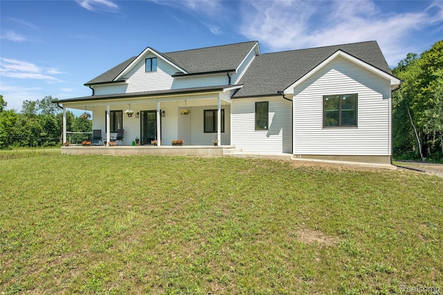 44200 Judd Rd, Belleville, MI 48111 - view of front of house featuring covered porch, a front yard, and roof with shingles