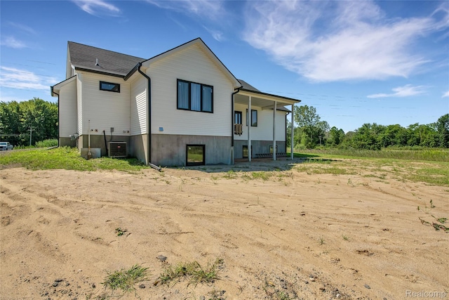 44200 Judd Rd, Belleville, MI 48111 - rear view of house with central AC unit