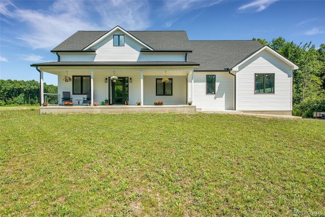 44200 Judd Rd, Belleville, MI 48111 - view of front facade with covered porch, a front lawn, and roof with shingles