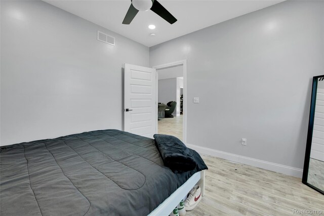 44200 Judd Rd, Belleville, MI 48111 - bedroom with light wood finished floors, baseboards, and ceiling fan