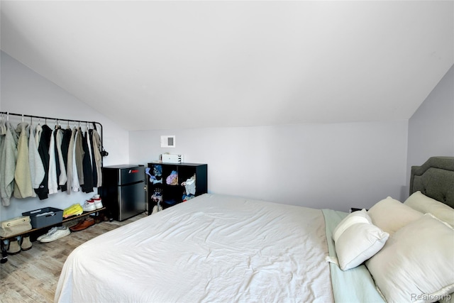 44200 Judd Rd, Belleville, MI 48111 - bedroom with lofted ceiling and wood finished floors