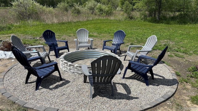 44200 Judd Rd, Belleville, MI 48111 - view of patio / terrace featuring an outdoor fire pit