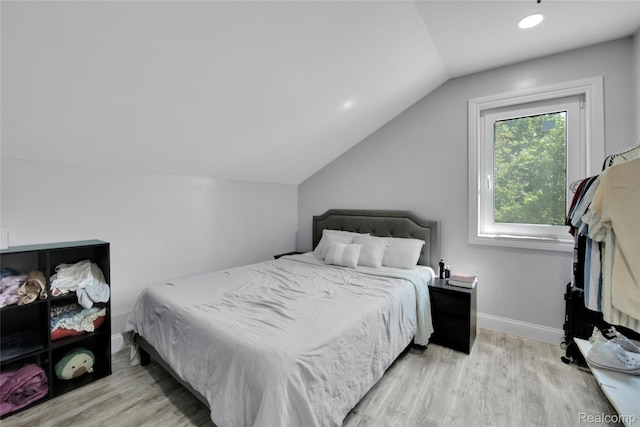 44200 Judd Rd, Belleville, MI 48111 - bedroom with wood finished floors, lofted ceiling, and baseboards