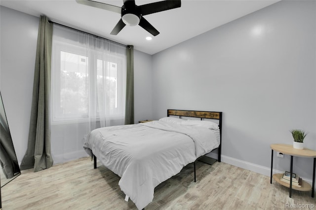 44200 Judd Rd, Belleville, MI 48111 - bedroom with wood finished floors, baseboards, recessed lighting, and ceiling fan