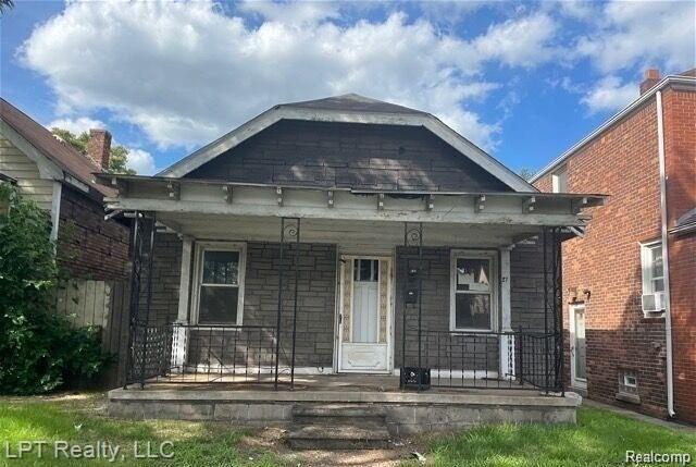 27 Orchard St, River Rouge, MI 48218 - view of front of property with a porch and cooling unit