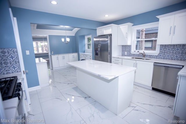 17352 Parkside St, Detroit, MI 48221 - kitchen with appliances with stainless steel finishes, a sink, a center island, white cabinetry, and recessed lighting