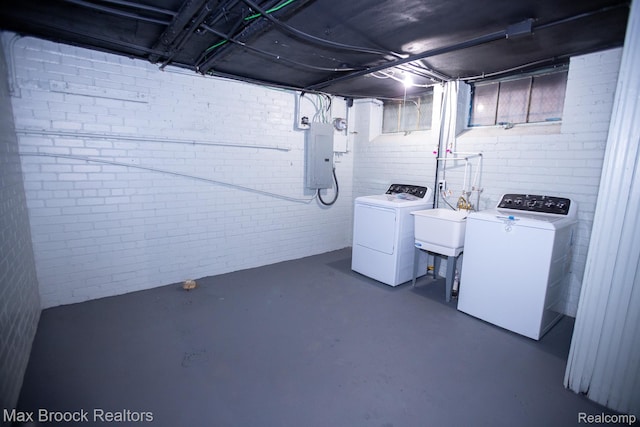 17352 Parkside St, Detroit, MI 48221 - unfinished below grade area with washer and clothes dryer, brick wall, and electric panel