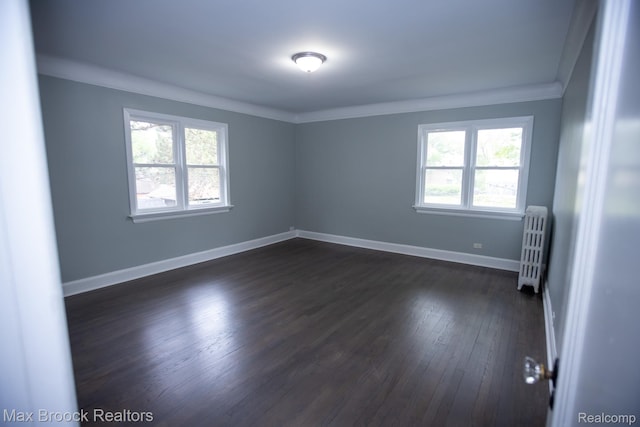 17352 Parkside St, Detroit, MI 48221 - unfurnished room featuring radiator, crown molding, dark wood-type flooring, and baseboards