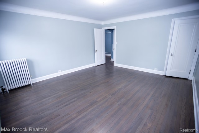 17352 Parkside St, Detroit, MI 48221 - empty room with radiator, dark wood-type flooring, baseboards, and ornamental molding