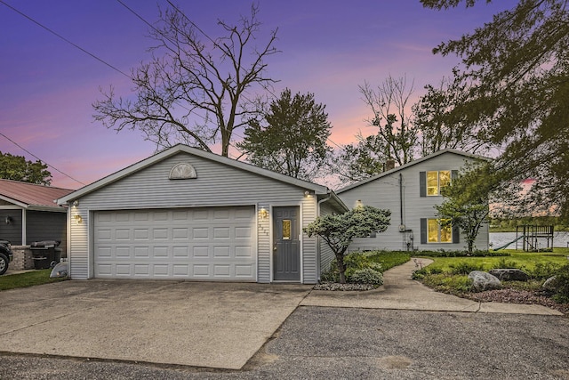 8928 Ellis St SE, Alto, MI 49302 - view of front of house featuring an outbuilding and concrete driveway