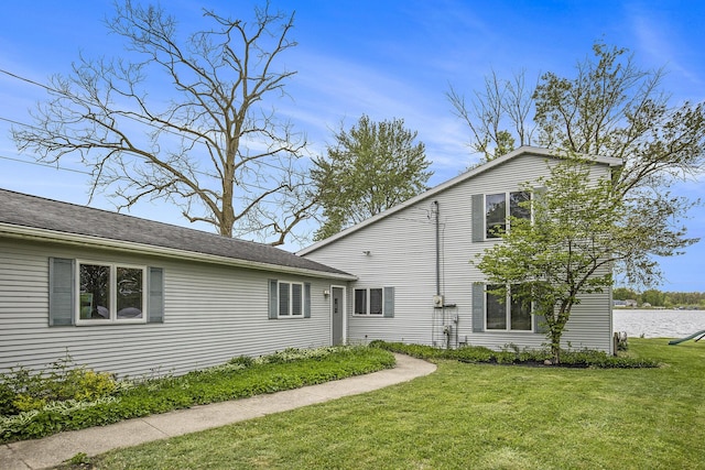 8928 Ellis St SE, Alto, MI 49302 - back of property with a yard and a water view