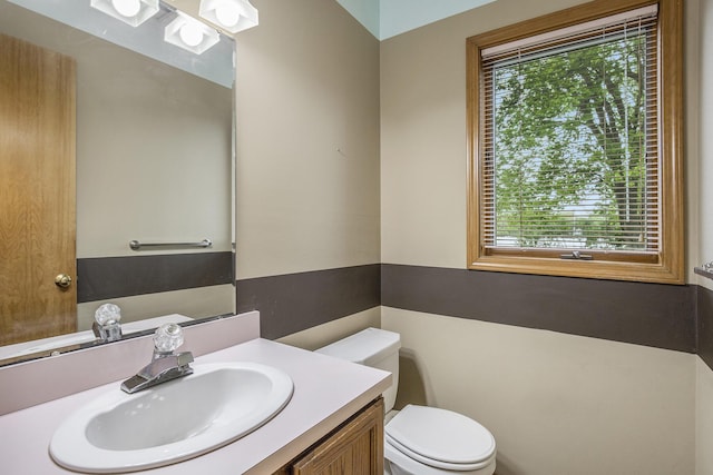 8928 Ellis St SE, Alto, MI 49302 - half bathroom with toilet and vanity