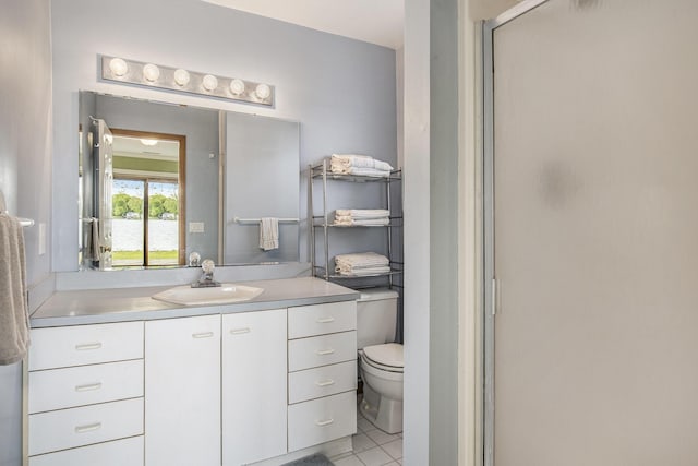 8928 Ellis St SE, Alto, MI 49302 - full bathroom featuring vanity, toilet, a stall shower, and tile patterned floors