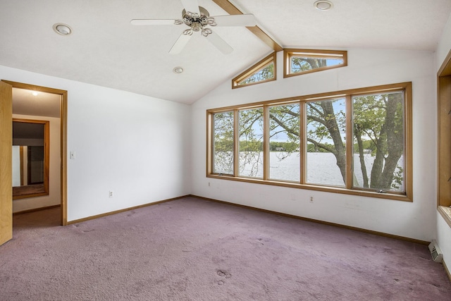 8928 Ellis St SE, Alto, MI 49302 - carpeted empty room with a water view, vaulted ceiling, baseboards, ceiling fan, and recessed lighting