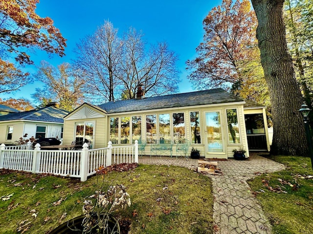456 E Gull Lake Dr, Augusta, MI 49012 - view of front facade with a chimney and a shingled roof