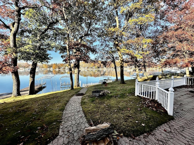 456 E Gull Lake Dr, Augusta, MI 49012 - view of grassy yard featuring a water view and a boat dock