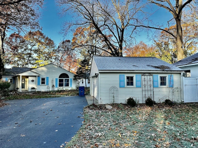 456 E Gull Lake Dr, Augusta, MI 49012 - view of front of house with asphalt driveway and roof with shingles
