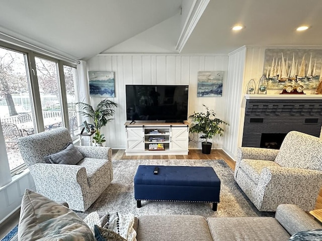 456 E Gull Lake Dr, Augusta, MI 49012 - living room featuring wood finished floors, vaulted ceiling, a fireplace, and recessed lighting
