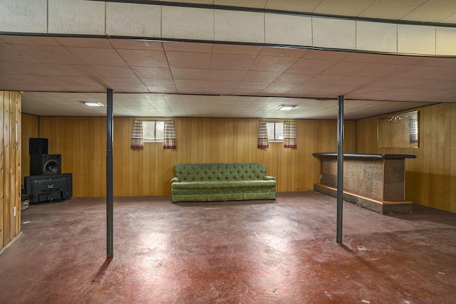 393 Merrill Ave, Muskegon, MI 49441 - below grade area with wood walls, a dry bar, and a paneled ceiling