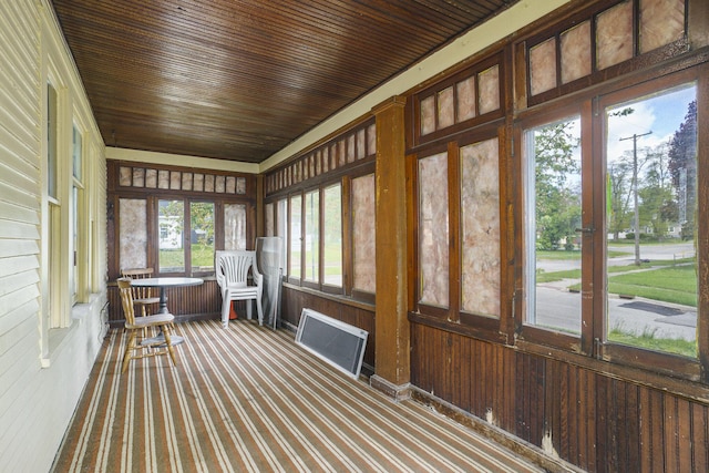 393 Merrill Ave, Muskegon, MI 49441 - sunroom / solarium featuring carpet floors and wood walls