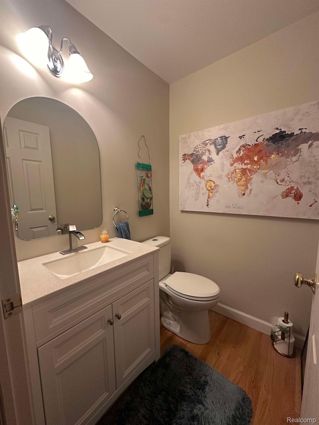 5400 Bright Creek Ct, Flint, MI 48532 - half bathroom with wood finished floors, toilet, and vanity