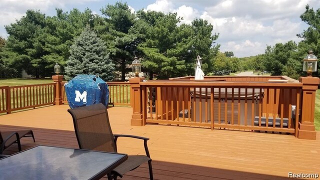 5400 Bright Creek Ct, Flint, MI 48532 - wooden terrace featuring view of wooded area and grilling area