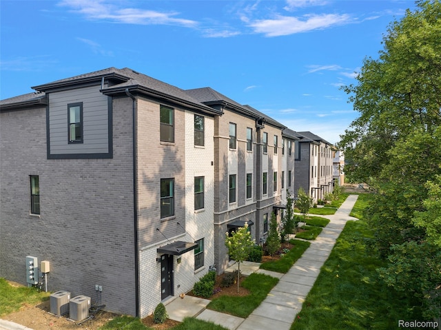 2817 Summers Pl, Troy, MI 48084 - view of building exterior featuring a residential view and central air condition unit